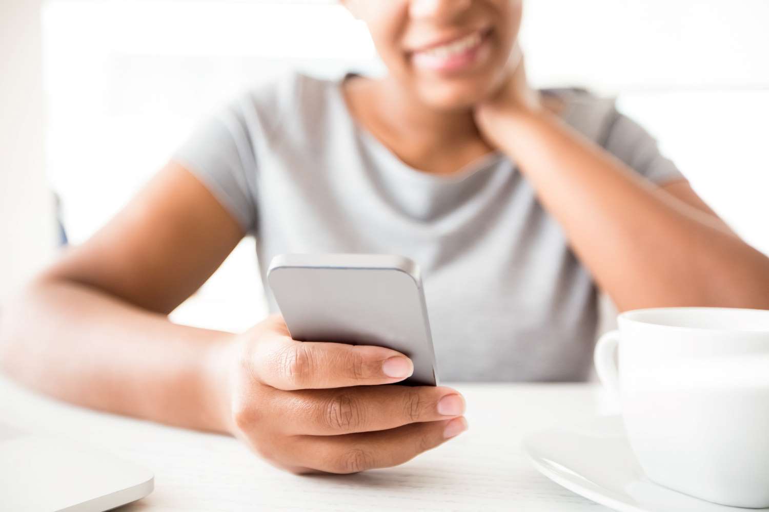 Lady sending a message from a mobile phone